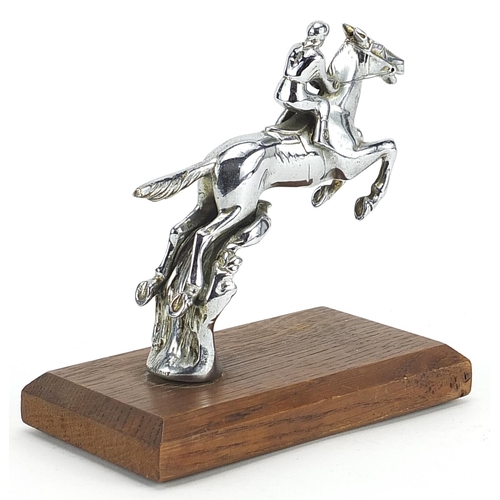 157 - Desmo, vintage chrome plated car mascot in the form of a jockey on horseback raised on a later woode... 