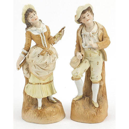 522 - Pair of continental bisque figures of a young couple, the largest 32cm high