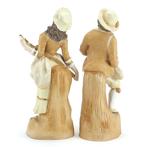 522 - Pair of continental bisque figures of a young couple, the largest 32cm high