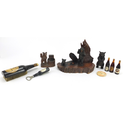 857 - Objects including Black Forest bear carvings and Guinness memorabilia, the largest 23.5cm wide