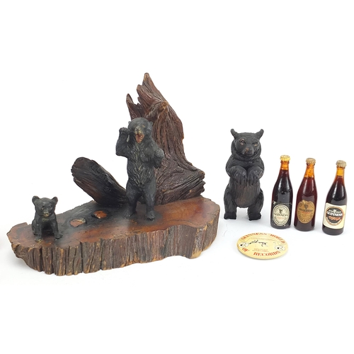 857 - Objects including Black Forest bear carvings and Guinness memorabilia, the largest 23.5cm wide