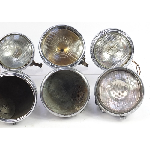337 - Nine vintage Joseph Lucas motor vehicle headlamps including King of the Road, type 148 and M141