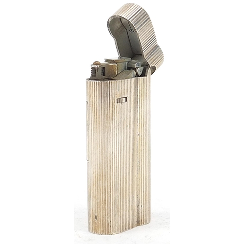 104 - Dunhill, silver plated pocket lighter with engine turned body numbered C64034, 6.5cm high