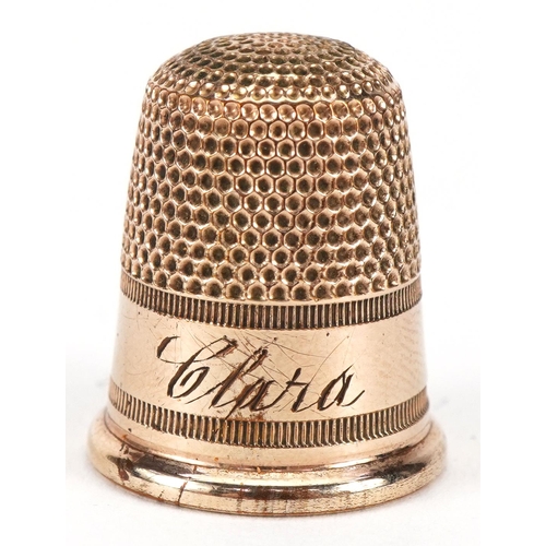 1012A - Yellow metal thimble housed in a tooled leather box in the form of a chest, the thimble 2.1cm high