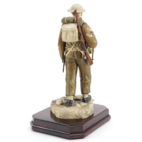 425 - Ashmore for Worcester porcelain commemorative military figure raised on a wooden plinth base, An Inf... 