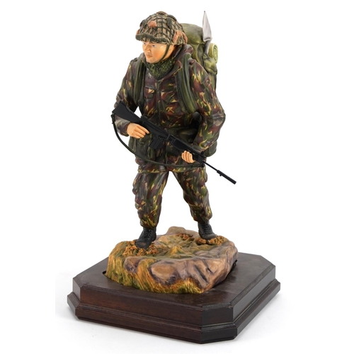 422 - Ashmore for Worcester porcelain commemorative military figure raised on a wooden plinth base, Soldie... 