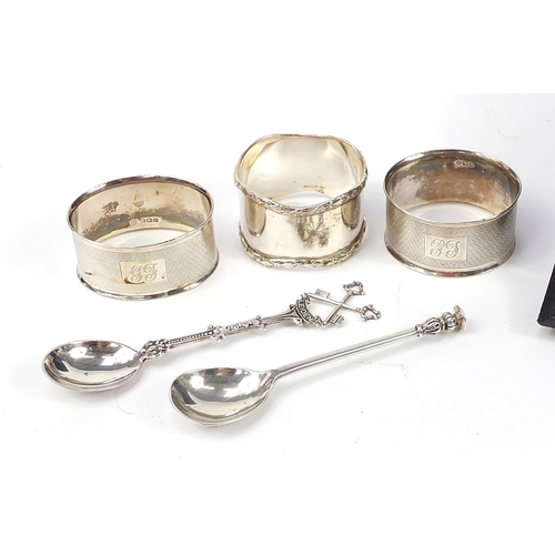 2132 - Silver objects comprising four piece dressing table set with fitted case, three napkin rings and two... 