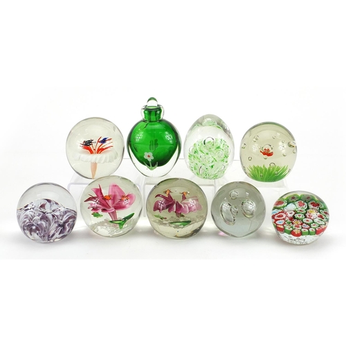 1020 - Eight colourful glass paperweights and a scent bottle with stopper, the largest 11cm high