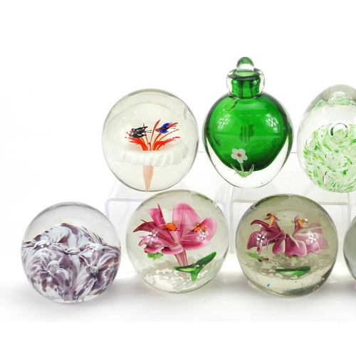 1020 - Eight colourful glass paperweights and a scent bottle with stopper, the largest 11cm high