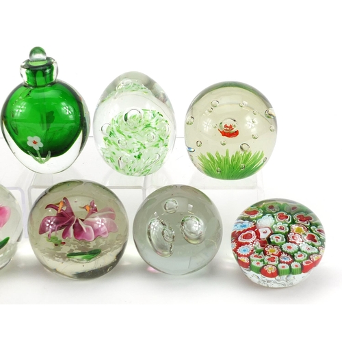 1020 - Eight colourful glass paperweights and a scent bottle with stopper, the largest 11cm high