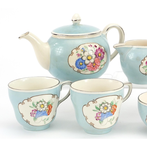 1015 - Gray's Pottery Pareek tea for two tea service hand painted with flowers, the teapot 19cm in length