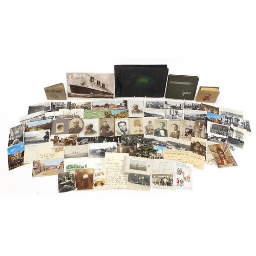 551 - Collection of 19th century and later postcards and photographs, some arranged in albums, including m... 