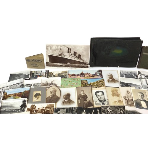 551 - Collection of 19th century and later postcards and photographs, some arranged in albums, including m... 