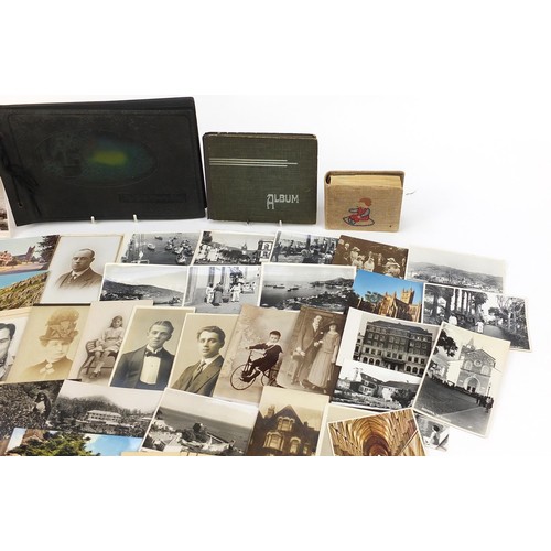 551 - Collection of 19th century and later postcards and photographs, some arranged in albums, including m... 