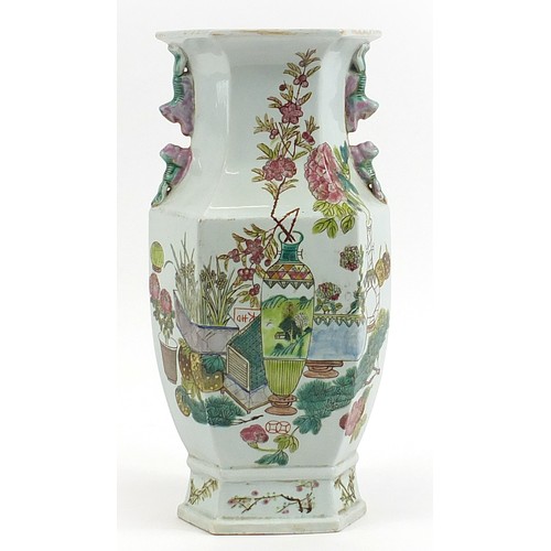 523 - Large Chinese porcelain hexagonal vase hand painted in the famille rose palette with vases of flower... 