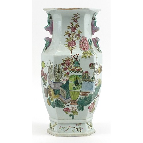 523 - Large Chinese porcelain hexagonal vase hand painted in the famille rose palette with vases of flower... 