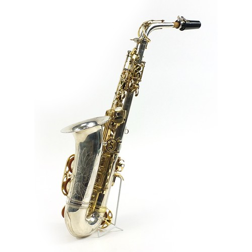 398 - Liberty by Selmer chrome plated and brass alto saxophone with protective carry case and stand, numbe... 