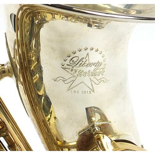 398 - Liberty by Selmer chrome plated and brass alto saxophone with protective carry case and stand, numbe... 