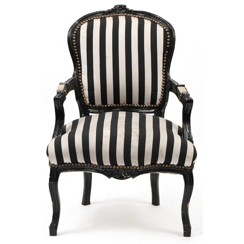 746 - French style black painted elbow chair with black and white striped upholstery, 92cm high