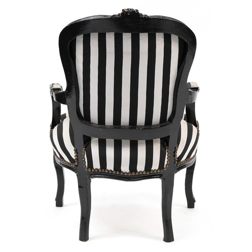 746 - French style black painted elbow chair with black and white striped upholstery, 92cm high