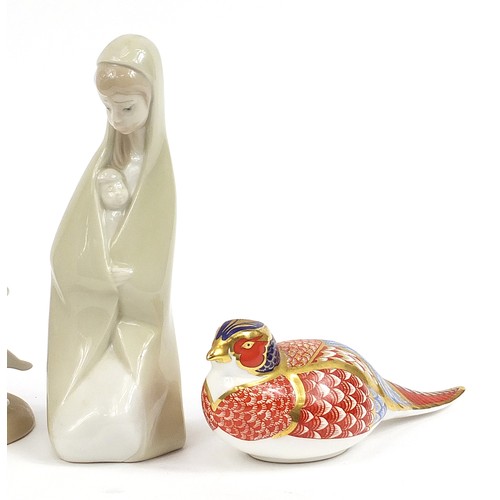 449 - Four Lladro porcelain figurines and a Royal Crown Derby Imari porcelain bird paperweight, the larges... 