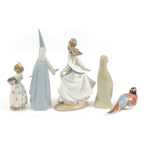 449 - Four Lladro porcelain figurines and a Royal Crown Derby Imari porcelain bird paperweight, the larges... 