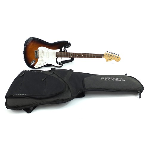 406 - 20th Anniversary Squire Strat by Fender electric guitar with a Ritter protective case, numbered CY02... 