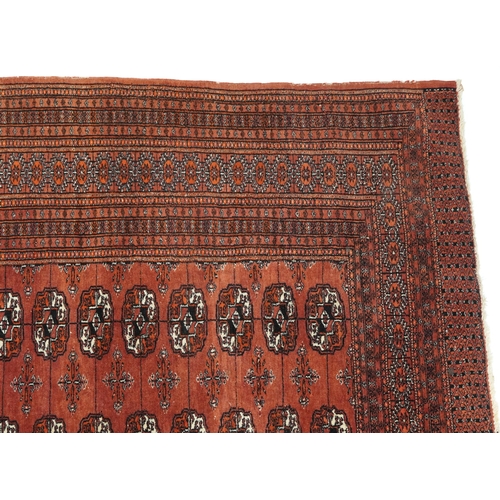 806 - Rectangular Bokhara red ground rug having an all over geometric design, 180cm x 128cm