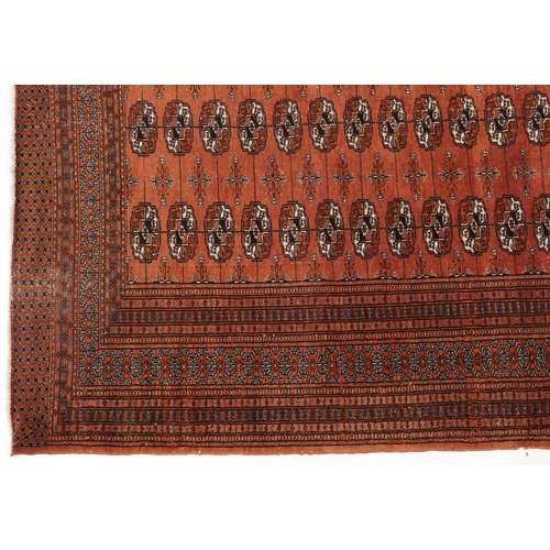 806 - Rectangular Bokhara red ground rug having an all over geometric design, 180cm x 128cm