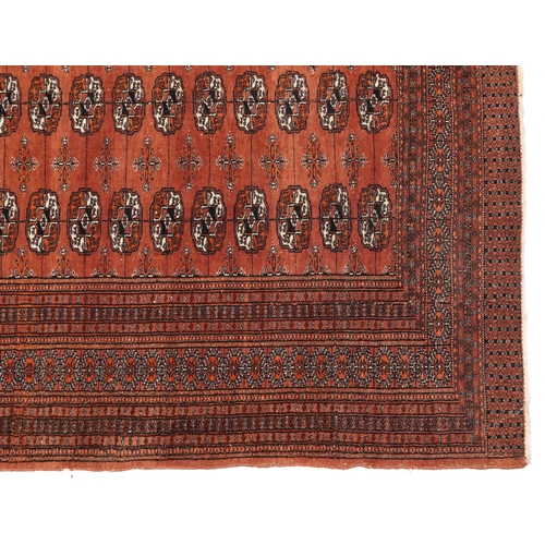 806 - Rectangular Bokhara red ground rug having an all over geometric design, 180cm x 128cm