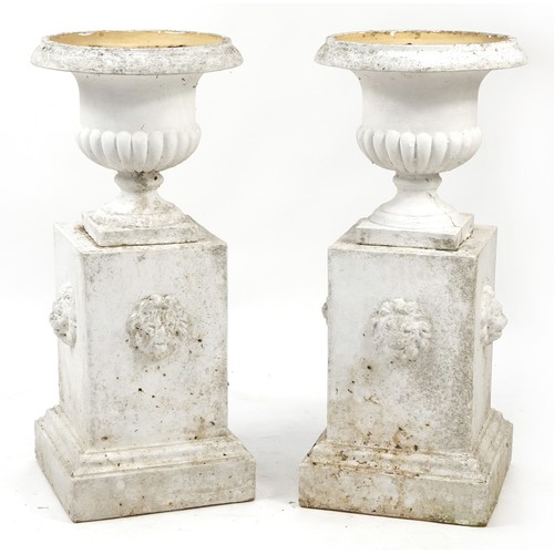 726 - Pair of white painted campana urn planter on stands with lion masks, 92cm high