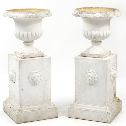 726 - Pair of white painted campana urn planter on stands with lion masks, 92cm high