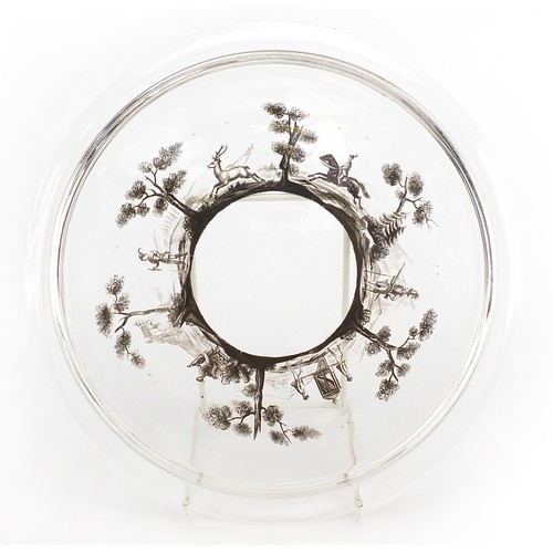 229 - Bohemian glass cabaret tray hand painted with huntsmen and deer in a landscape, 23.5cm in diameter