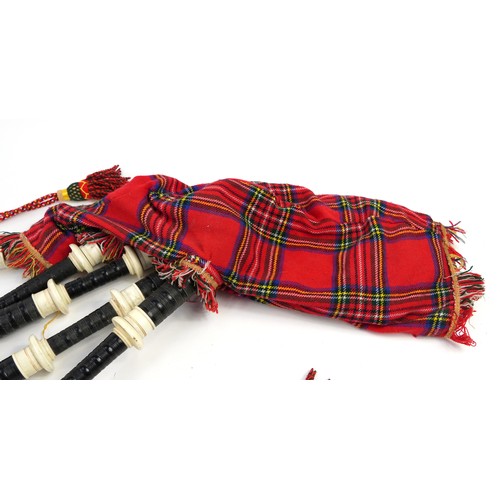 397 - Set of Scottish bagpipes with two kilts and a suit