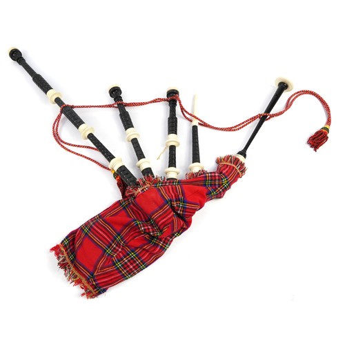 397 - Set of Scottish bagpipes with two kilts and a suit