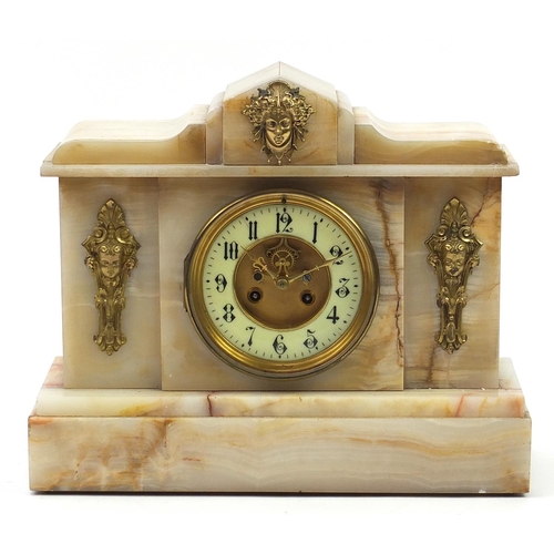 821 - White onyx striking mantle clock with gilt brass mounts, the enamelled chapter ring having Arabic nu... 