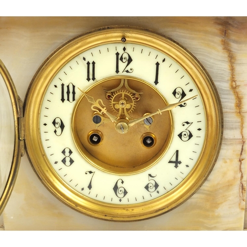 821 - White onyx striking mantle clock with gilt brass mounts, the enamelled chapter ring having Arabic nu... 