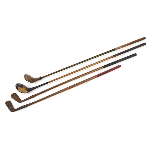 673A - Four early 20th century wooden shafted golf clubs, the largest 109cm in length