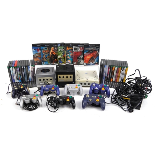 Two Nintendo Game Cube games consoles with controllers, games and a ...