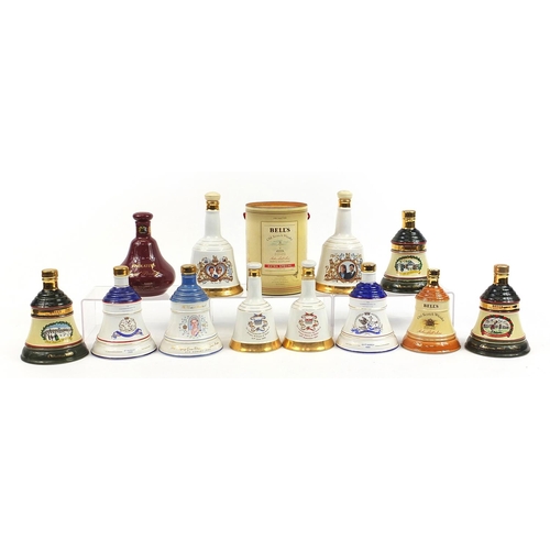 1178 - Twelve empty Bells whisky commemorative Wade  decanters