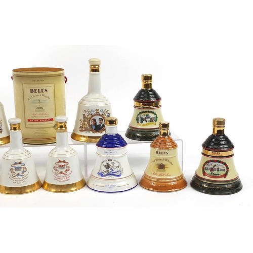 1178 - Twelve empty Bells whisky commemorative Wade  decanters