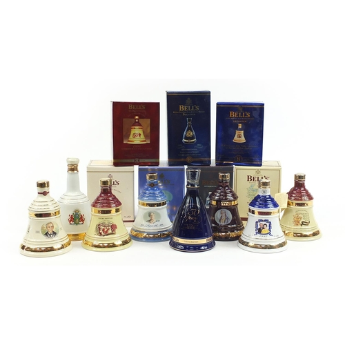 962 - Eight Bells 8 Year whisky commemorative sealed decanters with contents, seven with boxes, including ... 