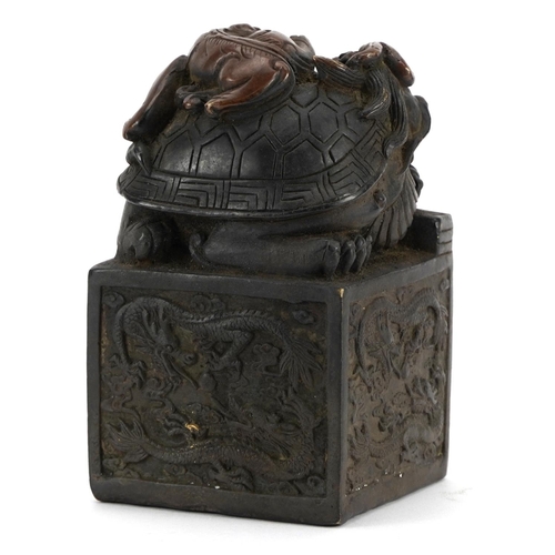 785 - Large Chinese patinated bronze seal with dragons, character marks to the base, 13cm high