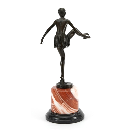 695 - Large patinated bronze figurine of an Art Deco dancer raised on a circular marble and black slate ba... 