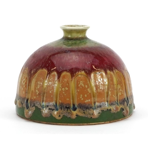 716 - Chinese porcelain beehive water pot having a red, orange and green dripping glaze, six figure charac... 