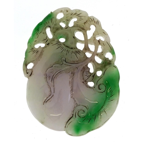 1050 - Chinese white and green jade pendant carved with fruit, 8.5cm high