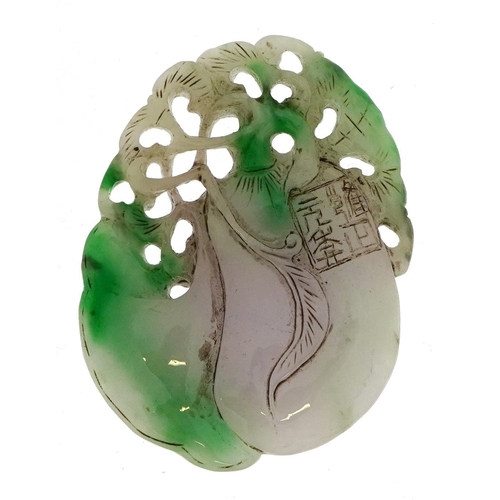 1050 - Chinese white and green jade pendant carved with fruit, 8.5cm high