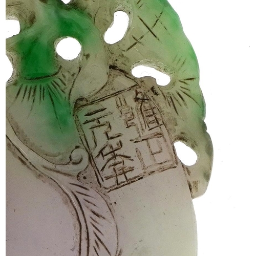 1050 - Chinese white and green jade pendant carved with fruit, 8.5cm high