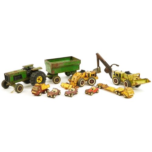 1568 - Vintage Tonka Toys tinplate vehicles including tractor with trailer and dumper truck, the largest 57... 