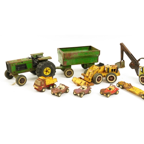 1568 - Vintage Tonka Toys tinplate vehicles including tractor with trailer and dumper truck, the largest 57... 